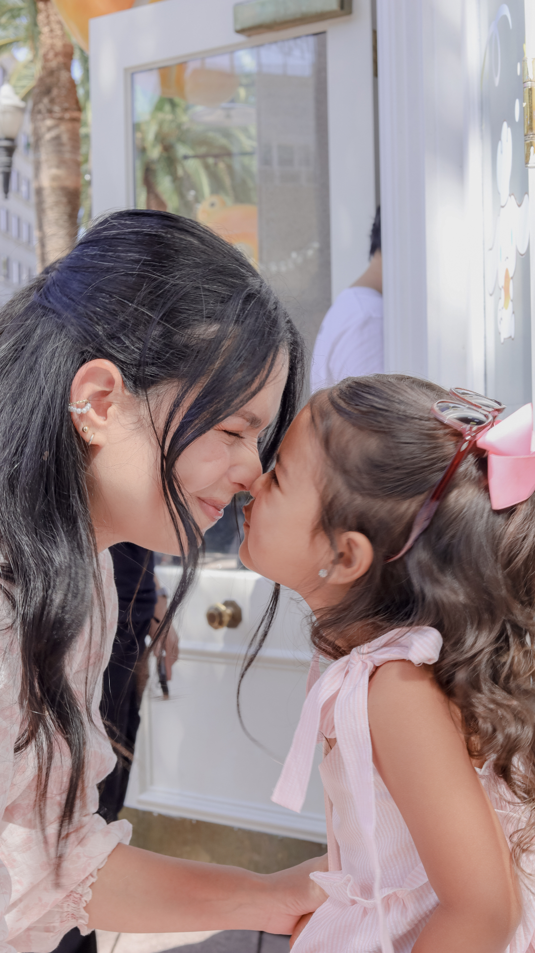 Mother and daughter nose to nose